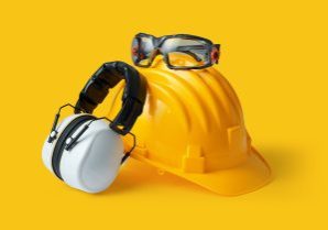 Safety helmet, ear muffs and goggles: personal protective equipment and workplace safety concept